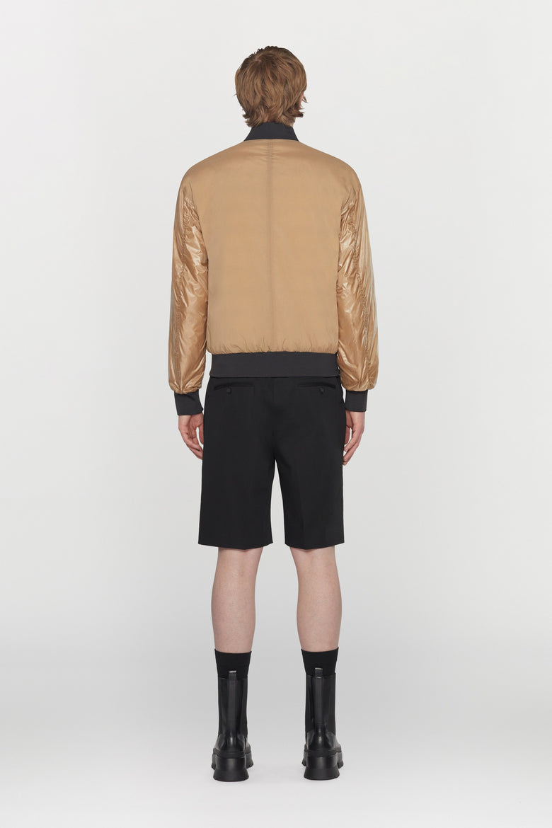 Reversible bomber jacket in water- repellent technical fabric with ribbed details