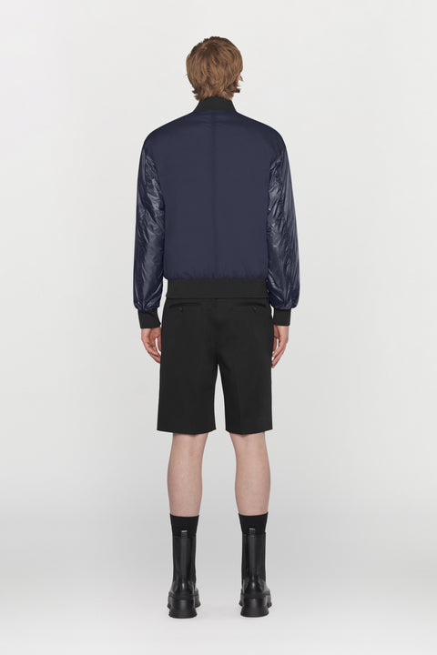 Bomber reversibile in tessuto tecnico idrorepellente con dettagli a costine