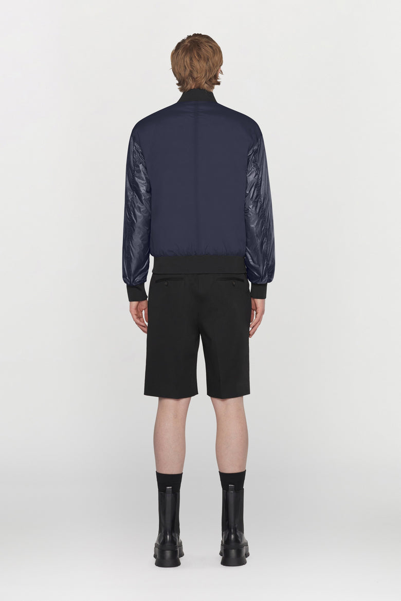 Bomber reversibile in tessuto tecnico idrorepellente con dettagli a costine